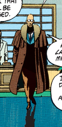 The same as the previous image of Hugo in his weird Sherlock Holmes getup, but it's a full-body shot. He appears to ALSO have different colour suit trousers!